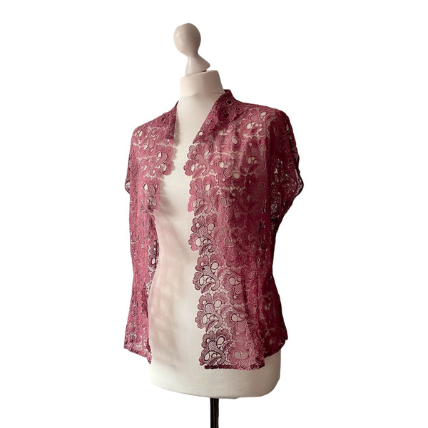 1930s to 1940s vintage Pink lace shrug on a mannequin against a white background