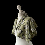 True vintage 1950's bolero jacket in a green beige and black Rayon satin floral print. at hurdyburdy vintage clothing shop