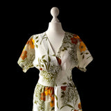 True vintage semi sheer white Nylon dress with a golden brown and orange floral print. at hurdyburdy vintage