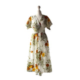 True vintage semi sheer white Nylon dress with a golden brown and orange floral print. at hurdyburdy vintage