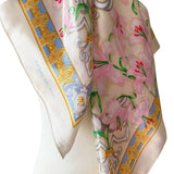 Floral Pierre Balmain vintage satin scarf with decorative border and pink lily print on a mannequin against a white background