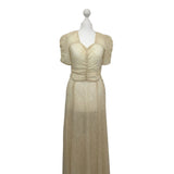 original 1930s sheer ivory lace dress on a mannequin against a white background