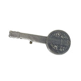 antique Silver banjo brooch on a black background