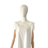 White antique chemise on a mannequin against a white background