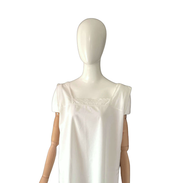 White antique chemise on a mannequin against a white background