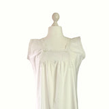 White sleeveless dress on a mannequin against a white background.antique-white-cotton-chemise-to-buy-hurdyburdy-vintage-