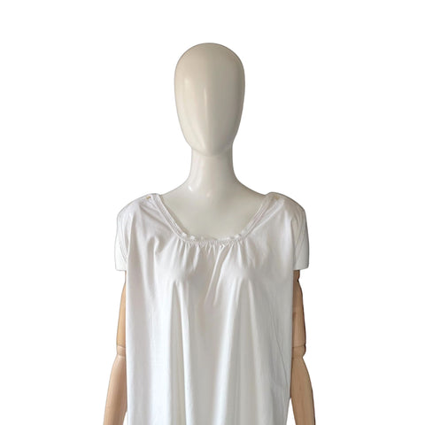 White sleeveless antique chemise on a mannequin against a white background