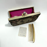 vintage-1950s-needlepoint-clutch-bag-with-shocking-pink-interior-and-brass-frame-by-peck-and-peck-fifth-avenue-with comb-and-leaflet-on-white-background-at-hurdyburdy-shop