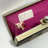 vintage-1950s-needlepoint-clutch-bag-with-shocking-pink-interior-and-brass-frame-by-peck-and-peck-fifth-avenue-on-white-background-at-hurdyburdy-shop