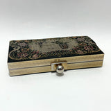 vintage-1950s-needlepoint-clutch-bag-with-brass-frame-by-peck-and-peck-fifth-avenue-on-white-background-at-hurdyburdy-shop