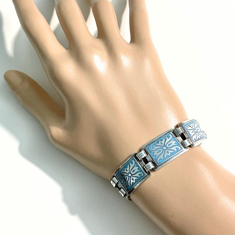 vintage-scandinavian-norwegian-panel-bracelet in blue and silver on hand mannequin at hurdyburdy vintage jewellery shop
