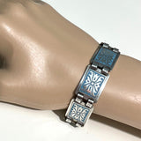 vintage-scandinavian-norwegian-panel-bracelet in blue and silver on hand mannequin at hurdyburdy vintage jewellery shop