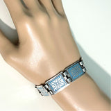 vintage-scandinavian-norwegian-panel-bracelet in blue and silver on hand mannequin at hurdyburdy vintage jewellery shop
