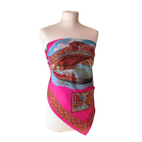 Shocking pink vintage Venice souvenir scarf featuring scenes and gondolas on white mannequin.