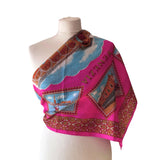 Shocking pink vintage Venice souvenir scarf featuring scenes and gondolas on white mannequin.